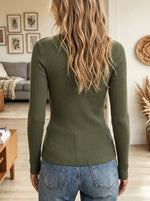 Elevate your everyday basics with this olive green ribbed knit top, styled with an asymmetric twist-front neckline, a playful chest cutout, and elegant pearl bead embellishments that bring refined sophistication to your look.